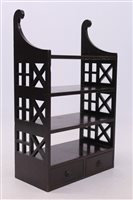 Lot 1697 - George III mahogany hanging shelves with three...