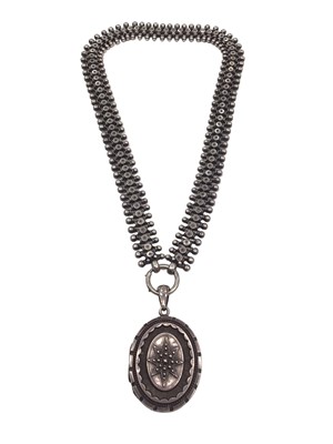 Lot 208 - Victorian silver oval locket pendant on a fancy link chain
