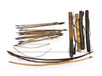 Lot 943 - Collection of twenty one antique African hunting arrows, five bows and four various hide arrow cases