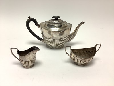 Lot 216 - Victorian silver three piece teaset with half reeded body