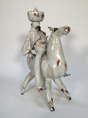 Lot 154 - Stanislas Reychan (1897-1994) studio pottery figure of a man on horseback, together with related article, 36cm high