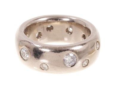 Lot 487 - Handmade 18ct white gold diamond set ring with a wide band of brilliant cut diamonds in a scattered design in rub over setting