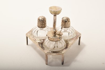 Lot 383 - Victorian Christopher Dresser for Hukin & Heath, electroplated cruet with silver-mounted glass bottles