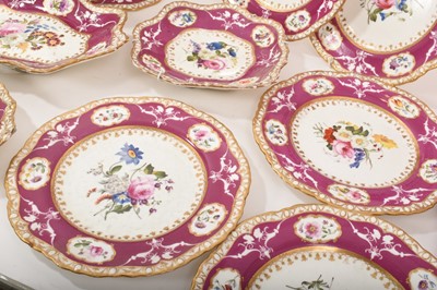 Lot 119 - 19th century Spode dessert service, painted and moulded with floral patterns on a puce and gilt ground, comprising 12 plates, 4 dishes and a centrepiece