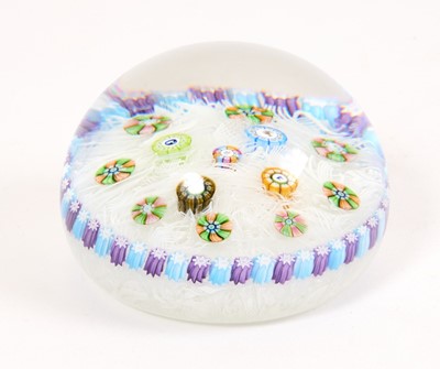 Lot 228 - Baccarat millefiori glass paperweight, decorated with canes on a latticino bed, the canes decorated with deer, a swan, a flower and a cat, the central stem possibly dated