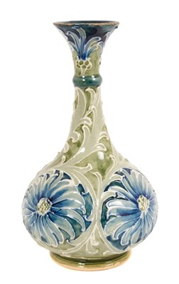 Lot 203 - William Moorcroft Florian ware bottle vase, with flared rim, tube-lined with daisies, signed to base, 15.5cm high
