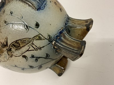 Lot 208 - Martin Brothers stoneware squat twin-handled vase, on four block feet, decorated with birds, signed to base, 9.5cm high