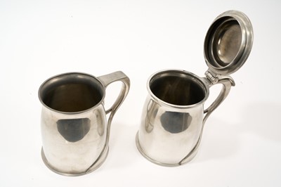 Lot 986 - Archibald Knox for Liberty Tudric lidded tankard. Model 066 and another