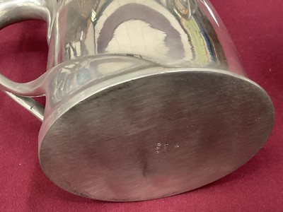 Lot 986 - Archibald Knox for Liberty Tudric lidded tankard. Model 066 and another