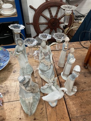 Lot 31 - A glass and brass five-branch candelabra with thistle decoration, together with a group of Nao and similar figures