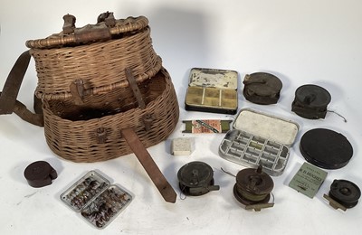Lot 1199 - Collection of vintage fishing reels including Victorian brass examples, cases of flies and line, contained in a wicker basket