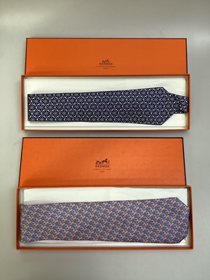 Lot 2083 - Four Hermès silk ties, cows and trees 7527 1A, geometric 5080 PA, navy horse bit 7297 EA and pink and blue Pegasus 5117 HA, all in Hermes tie boxes with tissue paper, two also in Hermes Christmas...