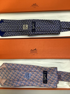 Lot 2083 - Four Hermès silk ties, cows and trees 7527 1A, geometric 5080 PA, navy horse bit 7297 EA and pink and blue Pegasus 5117 HA, all in Hermes tie boxes with tissue paper, two also in Hermes Christmas...
