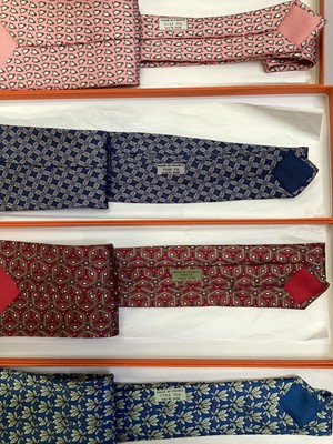 Lot 2086 - Four Hermès silk ties, leaves 7752 OA, geometric 7662 TA, penguins 5143 HA and interlinked cirles 7346 PAall in Hermes tie boxes with tissue paper