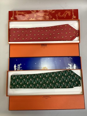Lot 2088 - Four Hermès silk ties, rice paddy fields 7535 IA, Owl and Moon 7997 EA, ships wheel 7317 EA and stylised flowers 5010 EA, all in Hermes tie boxes with tissue paper, two also in Hermes Christmas...