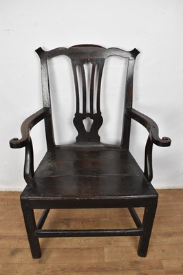Lot 1508 - Early 18th century oak country open armchair, having pierced vase shaped splat, scrolled arms and plank seat on square supports and stretchers