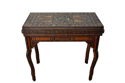 Lot 1567 - Ornate Damascus boxwood, bone and mother of pearl inlaid gaming table, the fold-over top enclosing further folding gaming boards and compartments, raised on shaped supports, 84cm wide x 42cm dee...