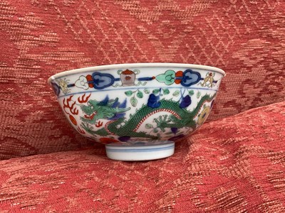 Lot 262 - A pair of Chinese porcelain bowls, Daoguang mark and period, decorated with a dragon and phoenix pattern in the Wucai style, 14.75cm diameter Provenance: brought home by Sir Francis Drum...
