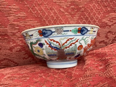 Lot 262 - A pair of Chinese porcelain bowls, Daoguang mark and period, decorated with a dragon and phoenix pattern in the Wucai style, 14.75cm diameter Provenance: brought home by Sir Francis Drum...