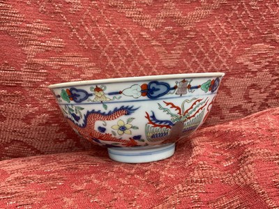 Lot 262 - A pair of Chinese porcelain bowls, Daoguang mark and period, decorated with a dragon and phoenix pattern in the Wucai style, 14.75cm diameter Provenance: brought home by Sir Francis Drum...