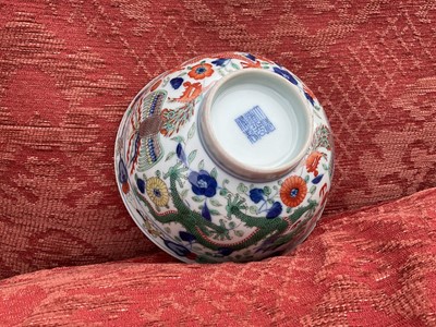 Lot 262 - A pair of Chinese porcelain bowls, Daoguang mark and period, decorated with a dragon and phoenix pattern in the Wucai style, 14.75cm diameter Provenance: brought home by Sir Francis Drum...