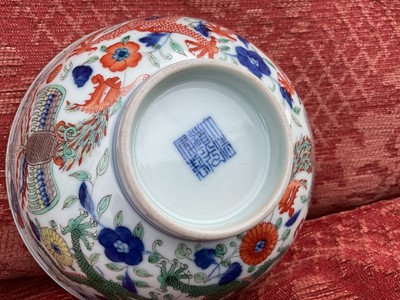 Lot 262 - A pair of Chinese porcelain bowls, Daoguang mark and period, decorated with a dragon and phoenix pattern in the Wucai style, 14.75cm diameter Provenance: brought home by Sir Francis Drum...