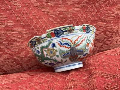Lot 262 - A pair of Chinese porcelain bowls, Daoguang mark and period, decorated with a dragon and phoenix pattern in the Wucai style, 14.75cm diameter Provenance: brought home by Sir Francis Drum...