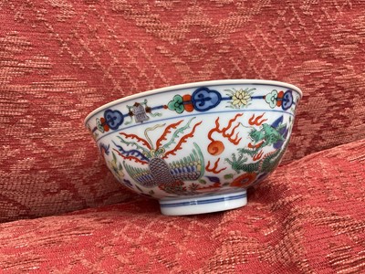 Lot 262 - A pair of Chinese porcelain bowls, Daoguang mark and period, decorated with a dragon and phoenix pattern in the Wucai style, 14.75cm diameter Provenance: brought home by Sir Francis Drum...
