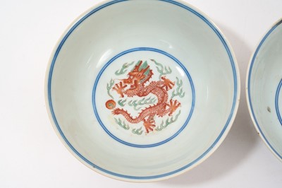 Lot 262 - A pair of Chinese porcelain bowls, Daoguang mark and period, decorated with a dragon and phoenix pattern in the Wucai style, 14.75cm diameter Provenance: brought home by Sir Francis Drum...