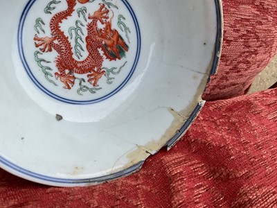 Lot 262 - A pair of Chinese porcelain bowls, Daoguang mark and period, decorated with a dragon and phoenix pattern in the Wucai style, 14.75cm diameter Provenance: brought home by Sir Francis Drum...
