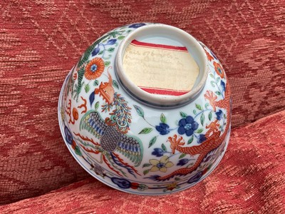 Lot 262 - A pair of Chinese porcelain bowls, Daoguang mark and period, decorated with a dragon and phoenix pattern in the Wucai style, 14.75cm diameter Provenance: brought home by Sir Francis Drum...
