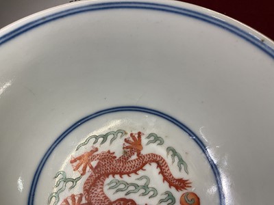 Lot 262 - A pair of Chinese porcelain bowls, Daoguang mark and period, decorated with a dragon and phoenix pattern in the Wucai style, 14.75cm diameter Provenance: brought home by Sir Francis Drum...
