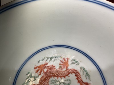 Lot 262 - A pair of Chinese porcelain bowls, Daoguang mark and period, decorated with a dragon and phoenix pattern in the Wucai style, 14.75cm diameter Provenance: brought home by Sir Francis Drum...