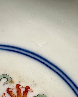 Lot 262 - A pair of Chinese porcelain bowls, Daoguang mark and period, decorated with a dragon and phoenix pattern in the Wucai style, 14.75cm diameter Provenance: brought home by Sir Francis Drum...