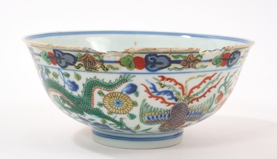 Lot 262 - A pair of Chinese porcelain bowls, Daoguang mark and period, decorated with a dragon and phoenix pattern in the Wucai style, 14.75cm diameter Provenance: brought home by Sir Francis Drum...