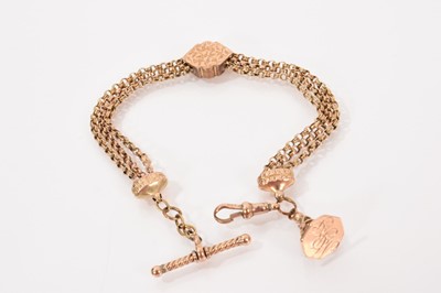 Lot 646 - Victorian gold Albertina bracelet with three rows of belcher link chains, a central gold slider with engraved scroll decoration and a gold fob seal