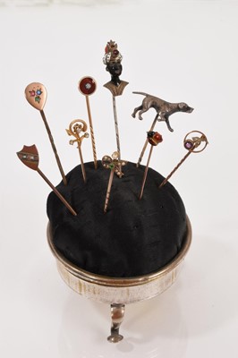 Lot 650 - Collection of nine Victorian stick pins in a plated pin cushion stand