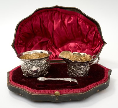 Lot 329 - Edwardian silver cream jug and sugar basin with tongs in fitted case/box.