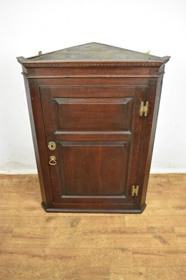 Lot 1538 - George III oak corner cupboard
