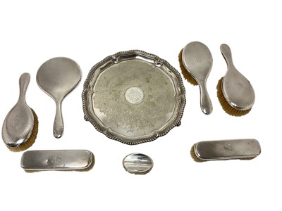 Lot 423 - Dressing table sets and a plated salver