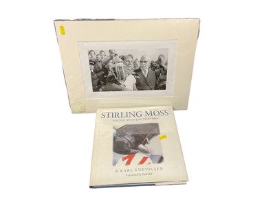 Lot 143 - Sir Stirling Moss photograph and 'Racing with the Maestro' book (2)