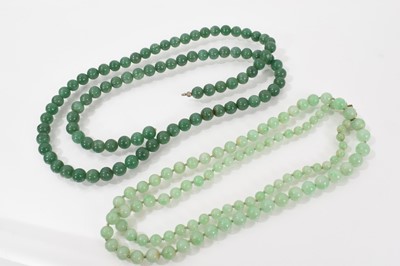 Lot 590 - Two Chinese green jade/hardstone bead necklaces