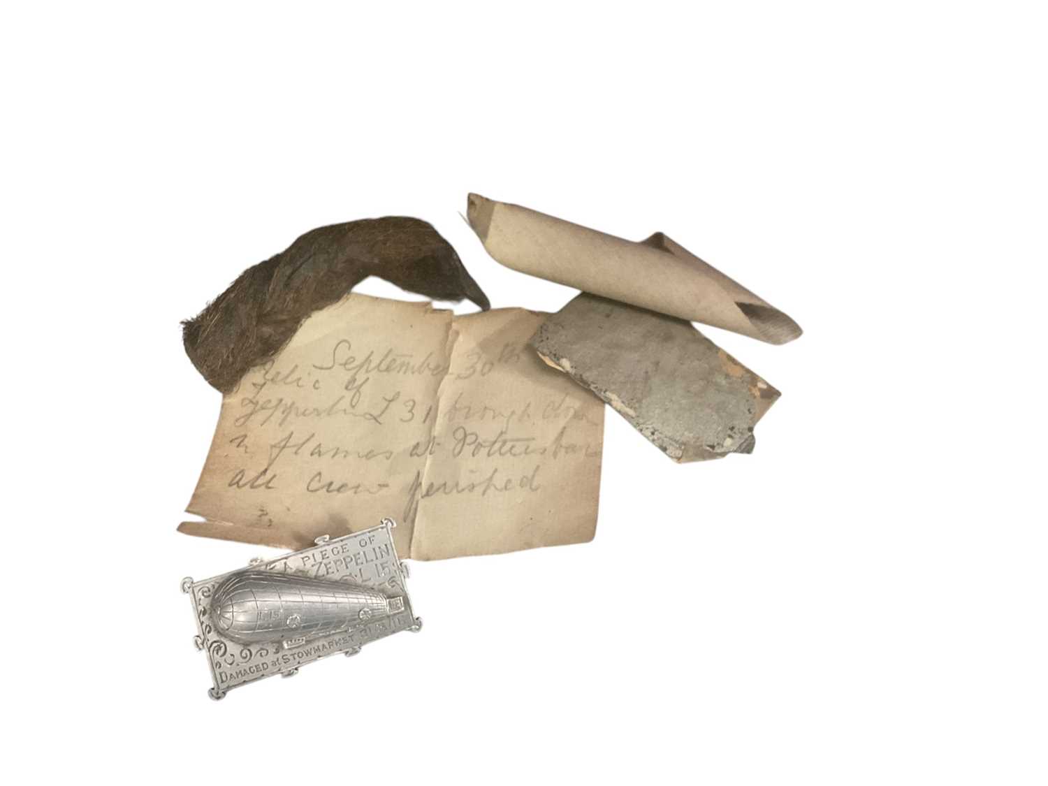 Lot 806 - First World War Zeppelin interest- fragment of L15 damaged at Stowmarket on 31st March 1916, together with fragments of L31 with hand written note (2).