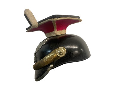 Lot 826 - Imperial German Uhlan NCO's Lance cap with black leather body, red and white piped cloth top, silvered eagle helmet plate , gilt brass chin scales and original black leather liner, Provenance...