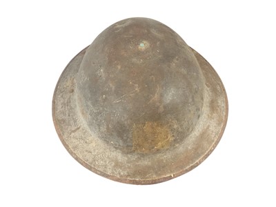 Lot 834 - First World War Mark 1 British Officers steel helmet with traces of square badges front and back, traces of liner and camouflage netting with leather chin strap, stamped numbers to rim