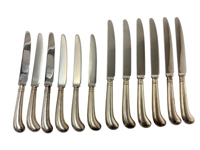 Lot 309 - Composite set of six table knives with silver pistol grip handles and six matching dessert knives