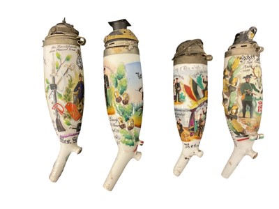 Lot 853 - Four Imperial German military porcelain Stummel pipe bowls with metal pickelhaube, Lance cap and Kepi covers, painted and transfer military decoration (4)