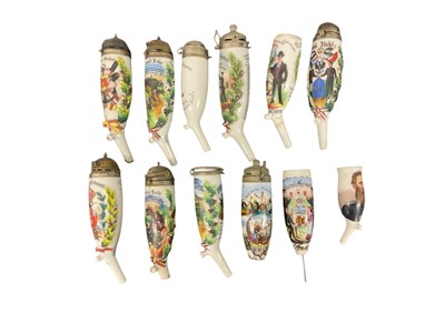 Lot 855 - Eleven Imperial German military porcelain Stummel pipe bowls, some with pickelhaube covers and all with painted and transfer Regimental decoration (11)