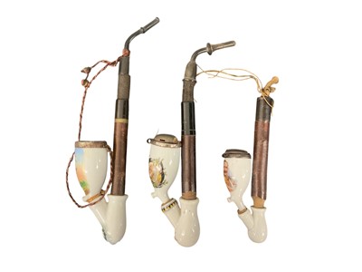 Lot 859 - Imperial German military pipe with Stummel porcelain bowl with painted and transfer decorated with military figure and two others (3)