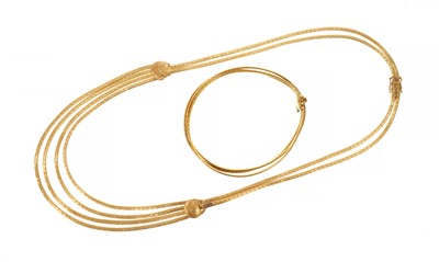 Lot 601 - Italian 18ct gold multi-strand necklace with articulated links, together with a similar 18ct gold three strand bracelet